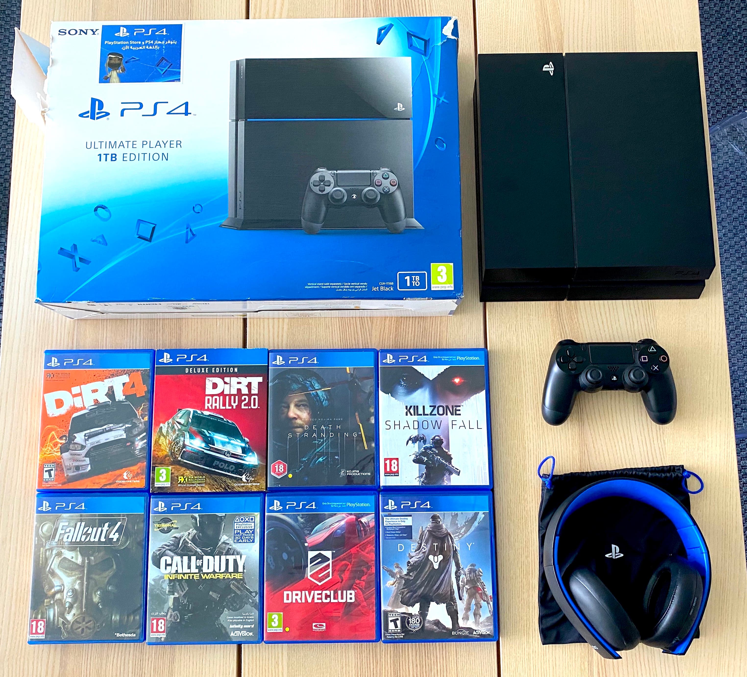 PS4 1TB + 8 Games - For Sale in Bahrain